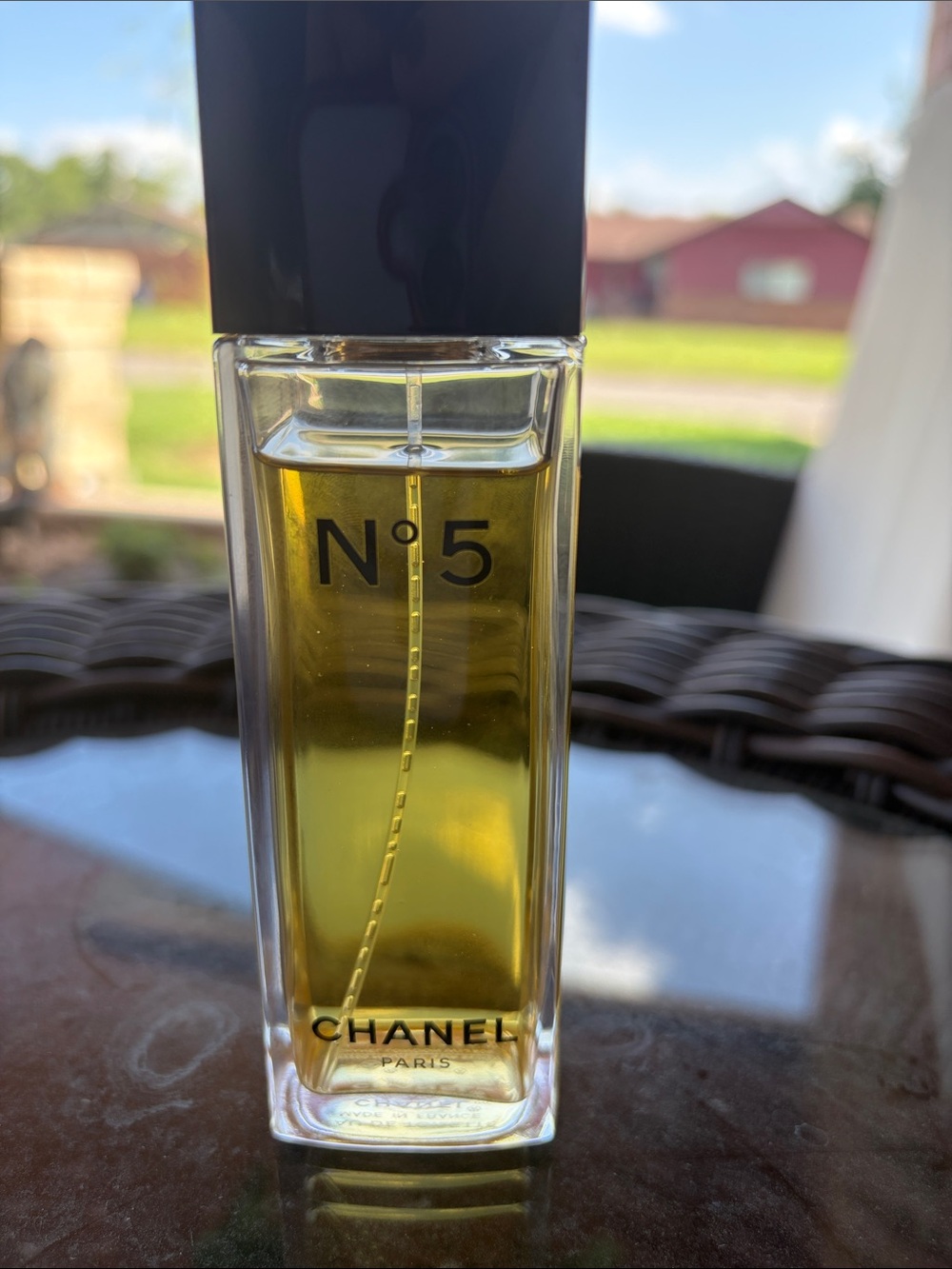 CHANEL — Clear Bottle with Black Cap and Golden Liquid - Picture 8 of 9